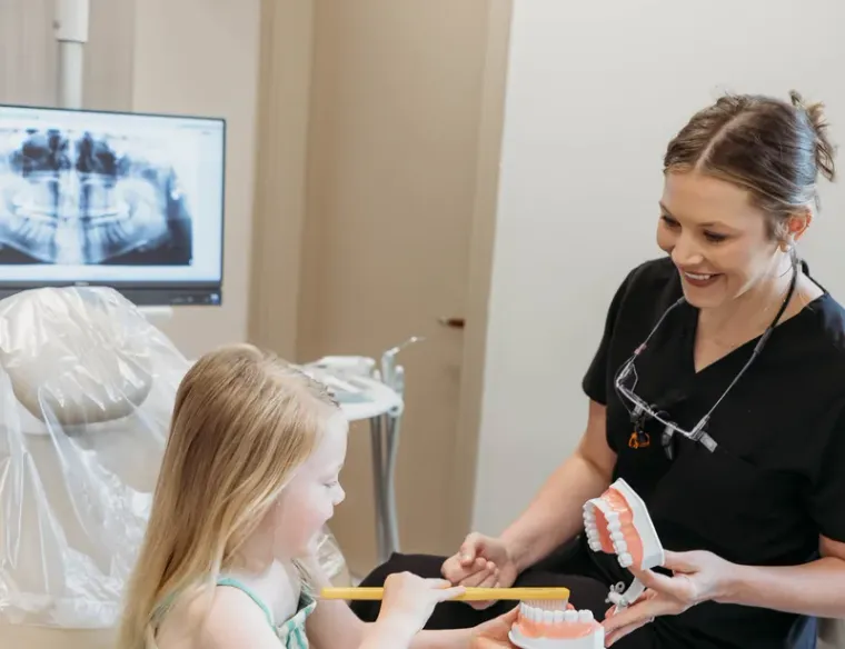 A Cactus Pear Dental team member welcoming a young patient